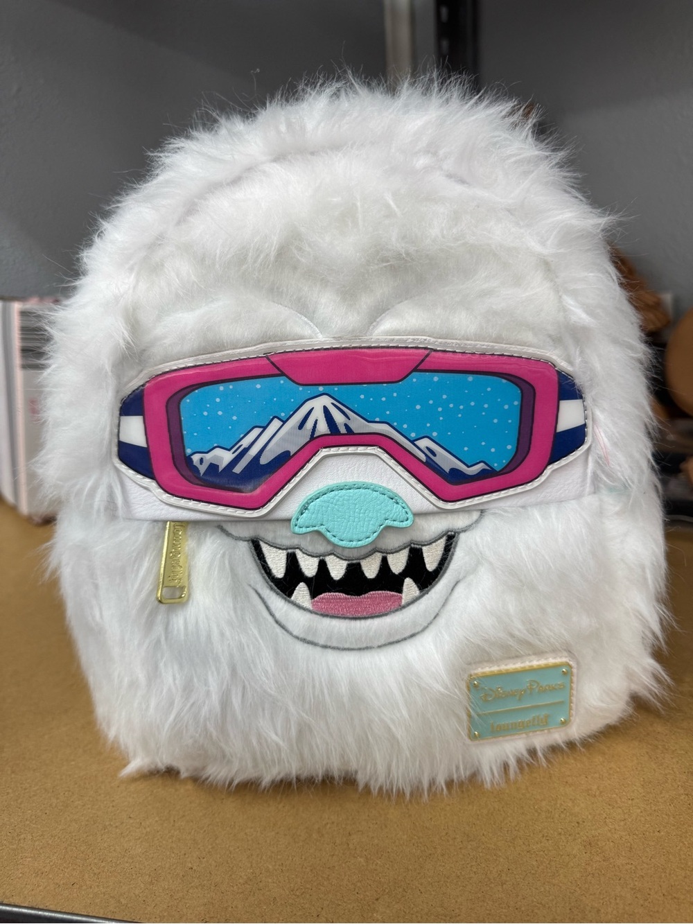 Loungefly Disney parks exclusive Yeti Backpack Goggles are lenticular